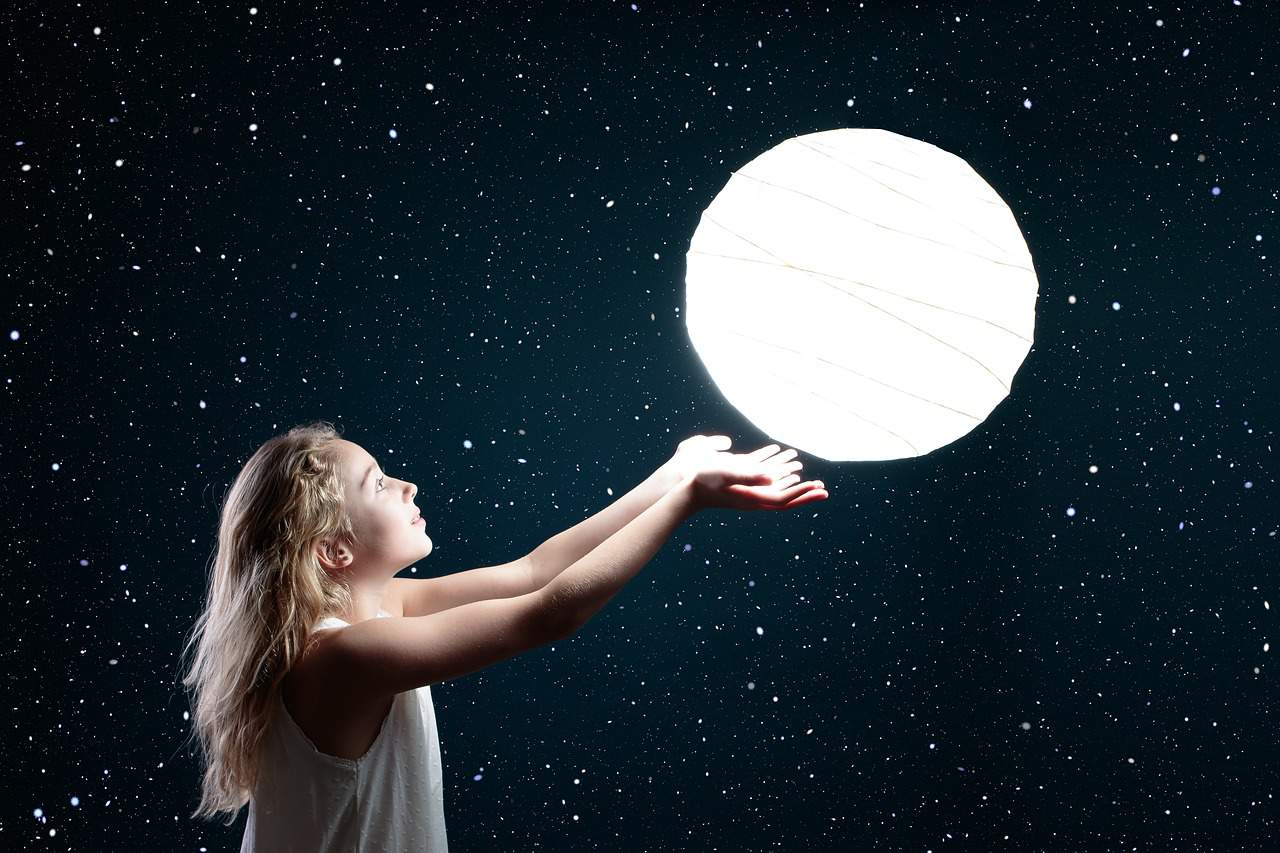 kid trying to catch the moon