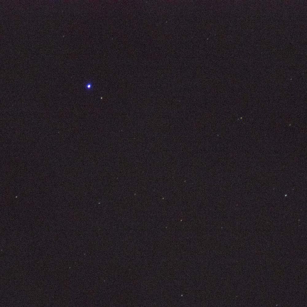 blue halo Chromatic aberration is visible around the brightest star