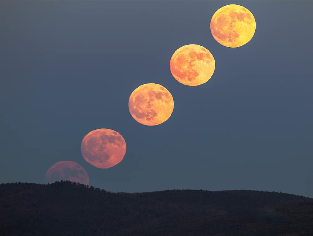 The Moon changes color as it climbs high in the sky