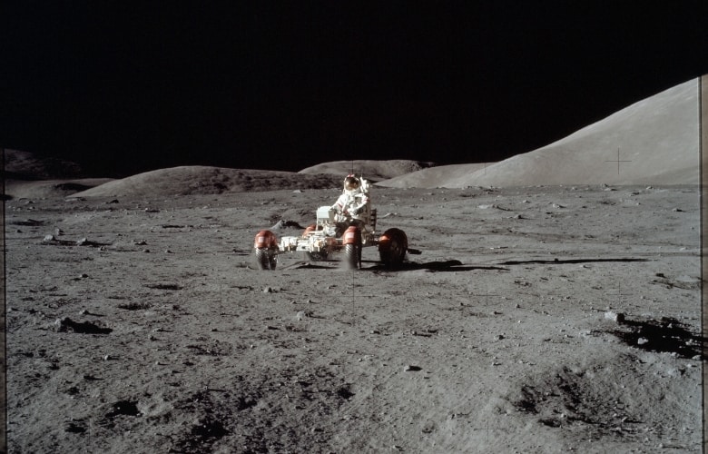 Astronaut Eugene Cernan drives the Lunar Roving Vehicle during first EVA